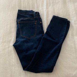 Women's maternity skinny jeans with side panel stretch.